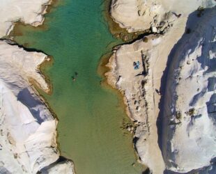 aerial view of body of water between rocks